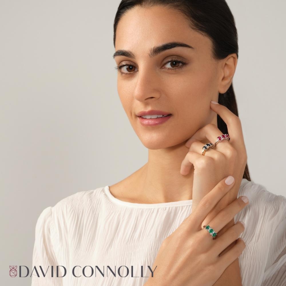David Connolly | Luxurious Three Stone Oval Emerald Ring With Diamond Details